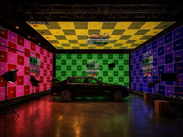 Car process setup surrounded by green LED panels.